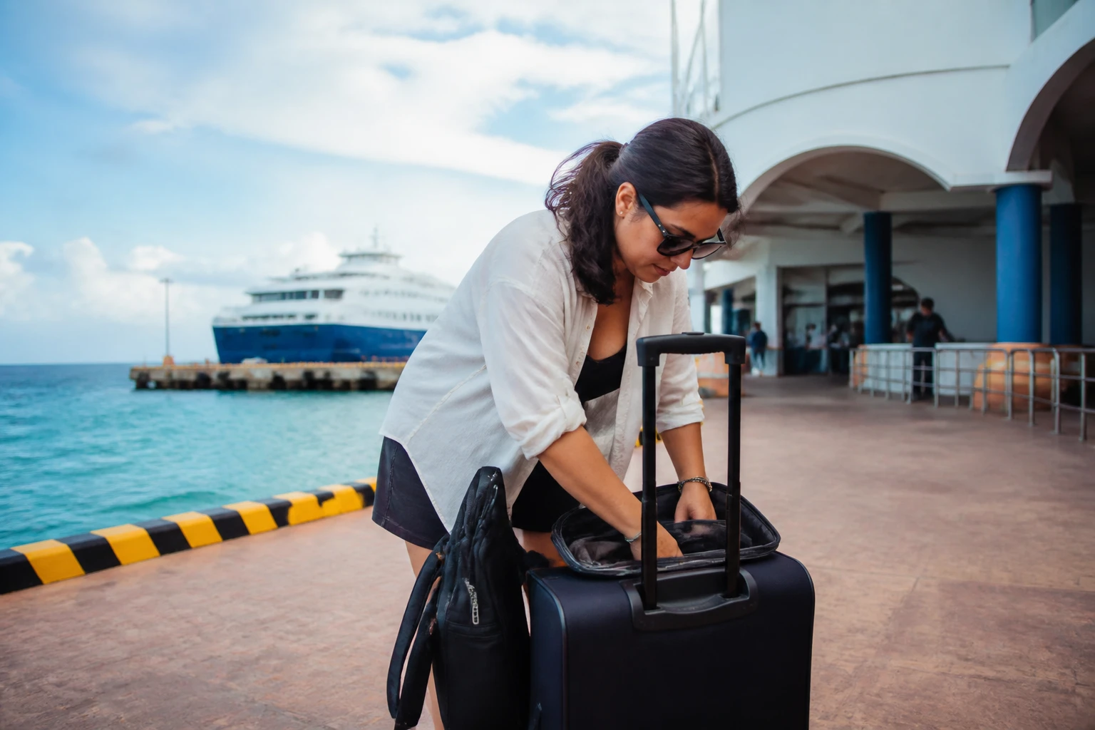 Solo traveler preparing for a ferry journey to Cozumel